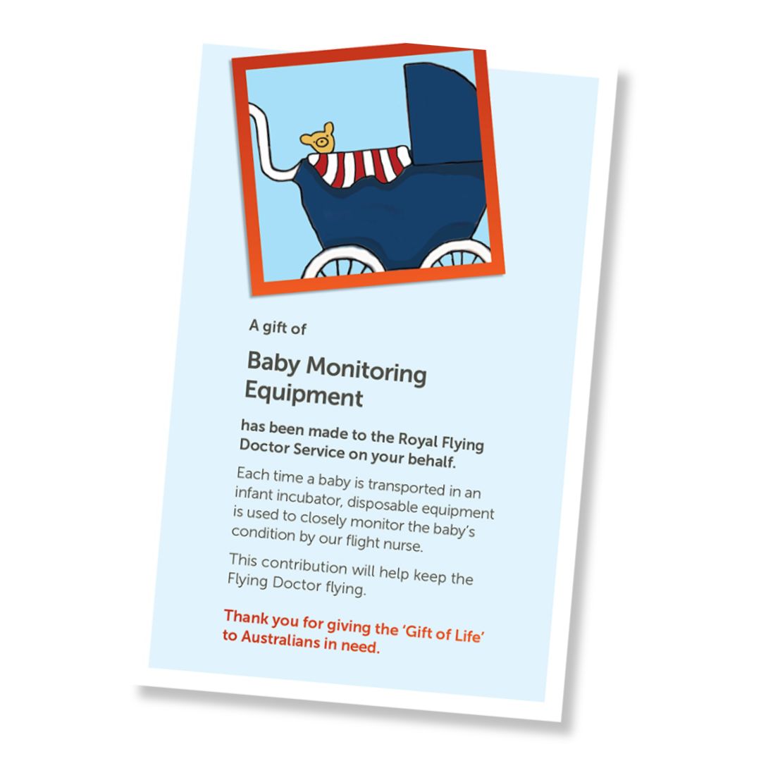 A card for a donation of baby monitoring equipment, shown at an angle on a white background. The card has a pale blue field, a small illustrated header with a pram with a teddy bear in it, and a red-orange border, and text stating it is a gift of baby monitoring equipment and a that it is a donation to the Royal Flying Doctor Service. 