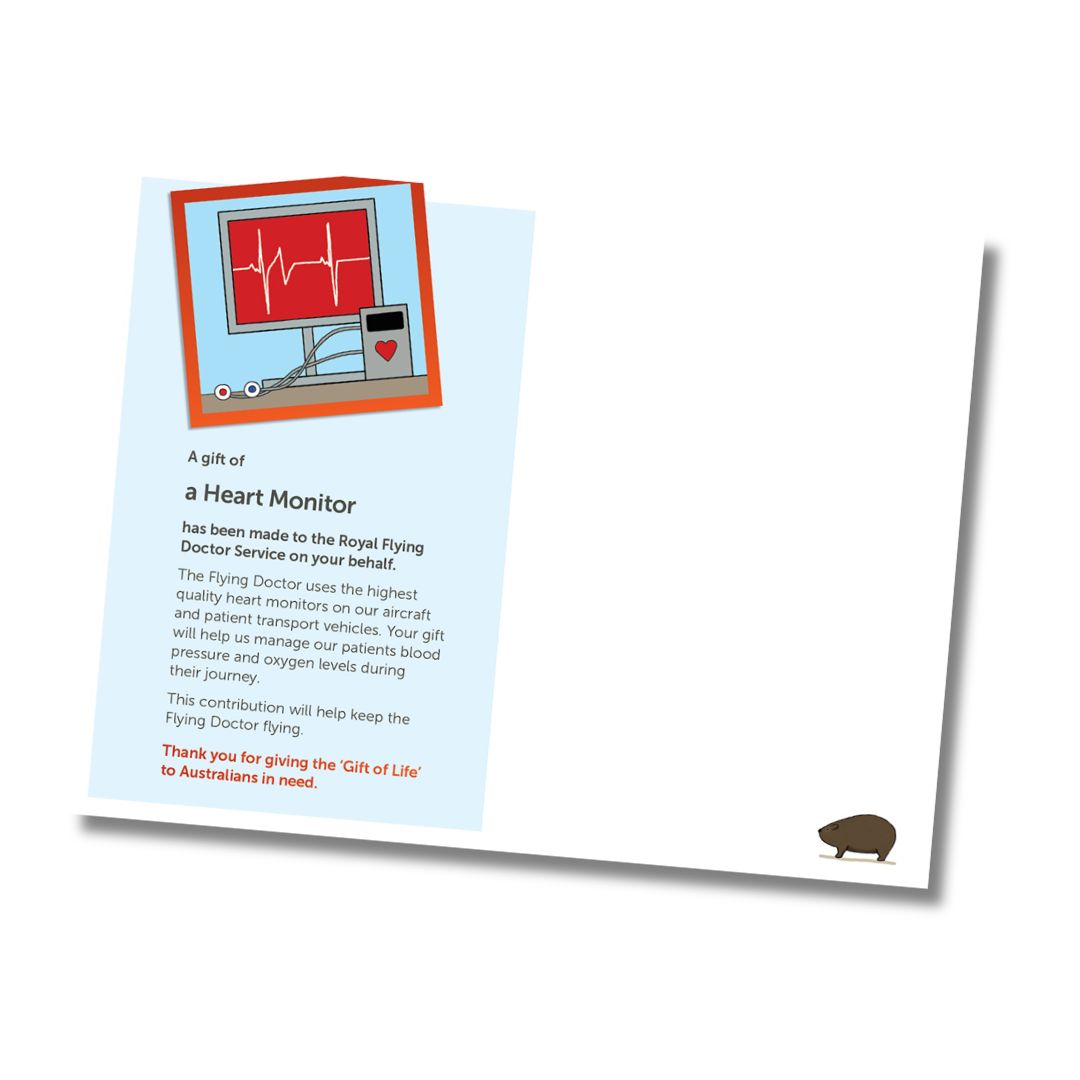 Inside of a card for donation of a heart monitor for Royal Flying Doctor Service, shown at an angle on a white background. The card has a light blue header area with an illustration of a heart monitor EKG on a cart, black and red text, and a small brown wombat in the bottom right corner.